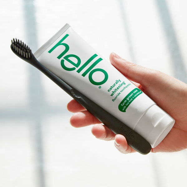 using hello naturally-whitening toothpaste